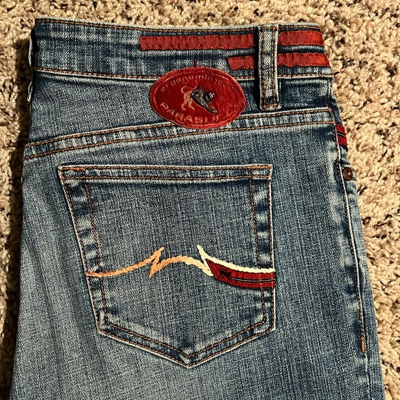 Size 29 flare jeans with maroon brown and tan ribbon designs on bottom parts - Picture 2 of 7